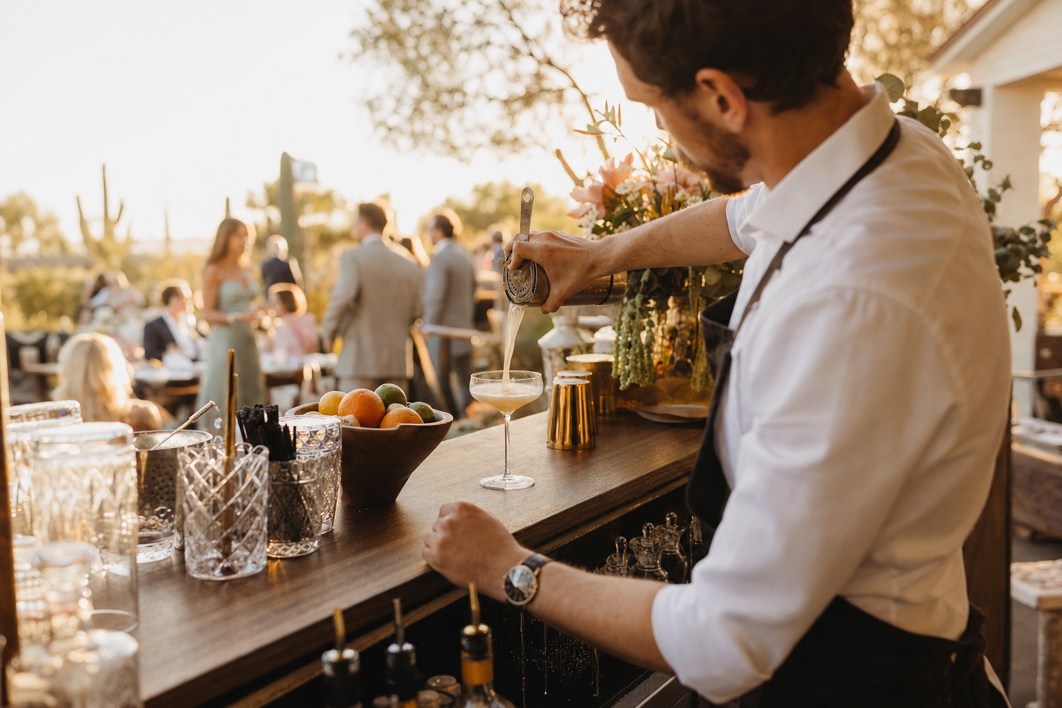 Bartender pouring a craft cocktail