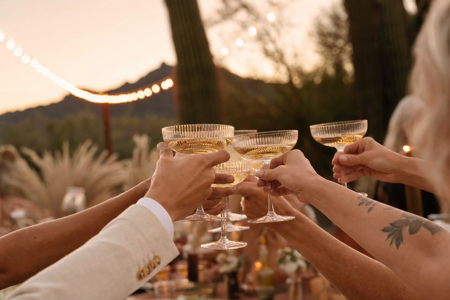 Guests toasting with cocktails